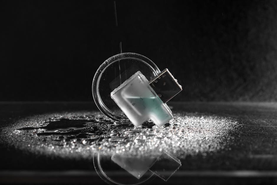 A group of diverse professionals collaborating in a modern office setting with laptops and technology.