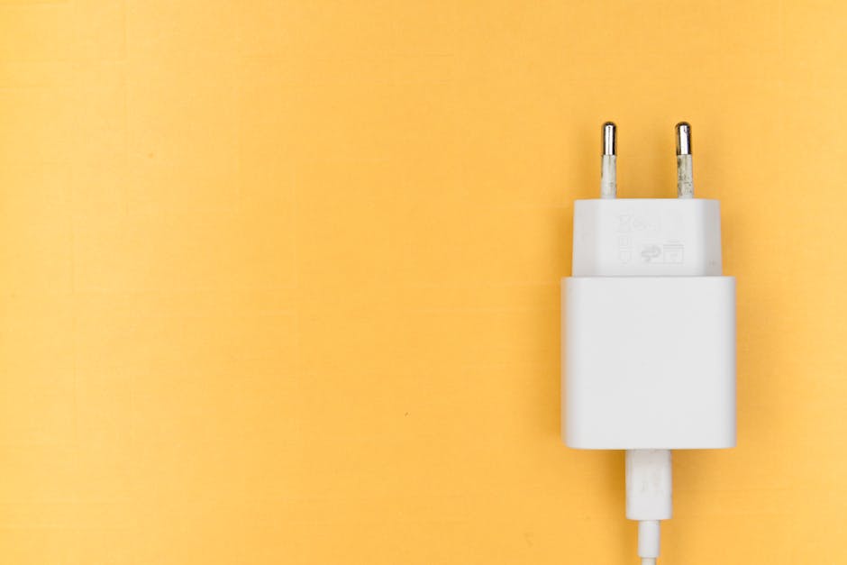 A diverse business team collaborates on projects in a modern office setting, using technology and notes.