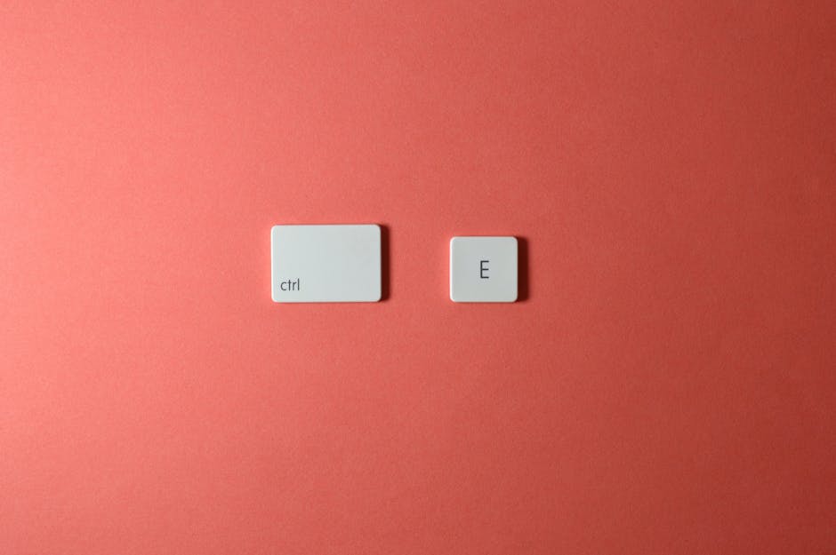 A diverse group of professionals working together on laptops in a modern office meeting room.