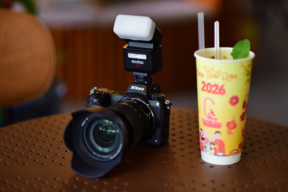 Close-up of a laptop and tablet on a wooden desk, showcasing modern technology.