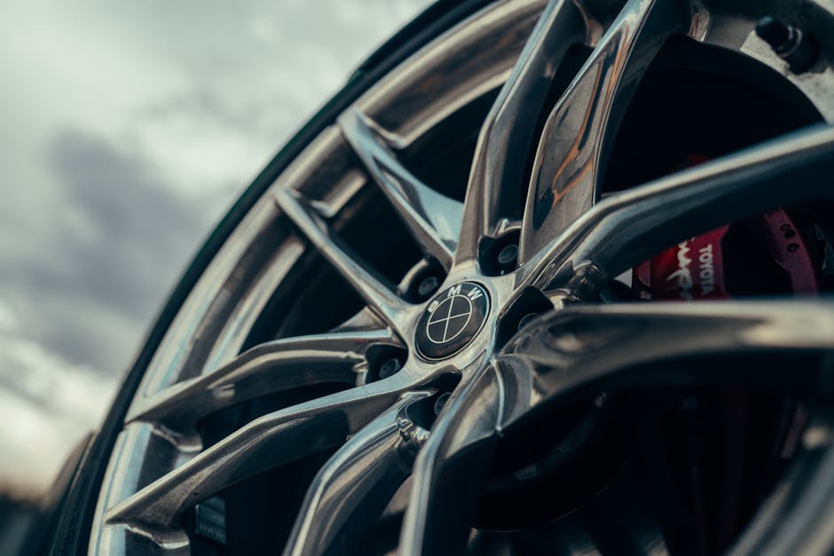 A group of diverse professionals collaborating in a modern office setting with laptops and technology.