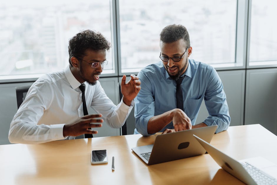 Engaged business professionals collaborating in a modern office setting.