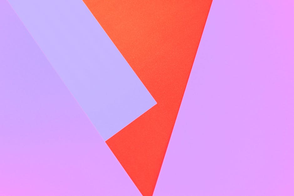 Vibrant geometric abstract artwork with red and purple shapes. Ideal for modern design.