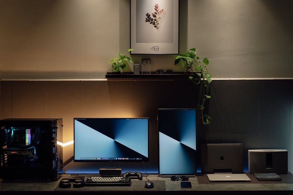 A sleek home office setup with dual monitors, potted plants, and tech gadgets in a modern interior.