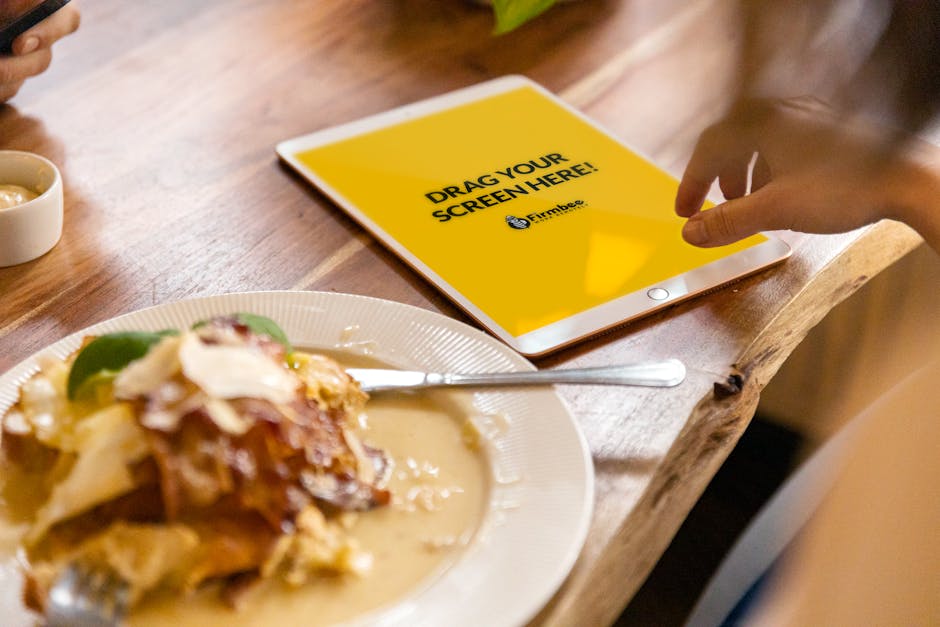 A person using a laptop to interact with AI technology indoors during the day.