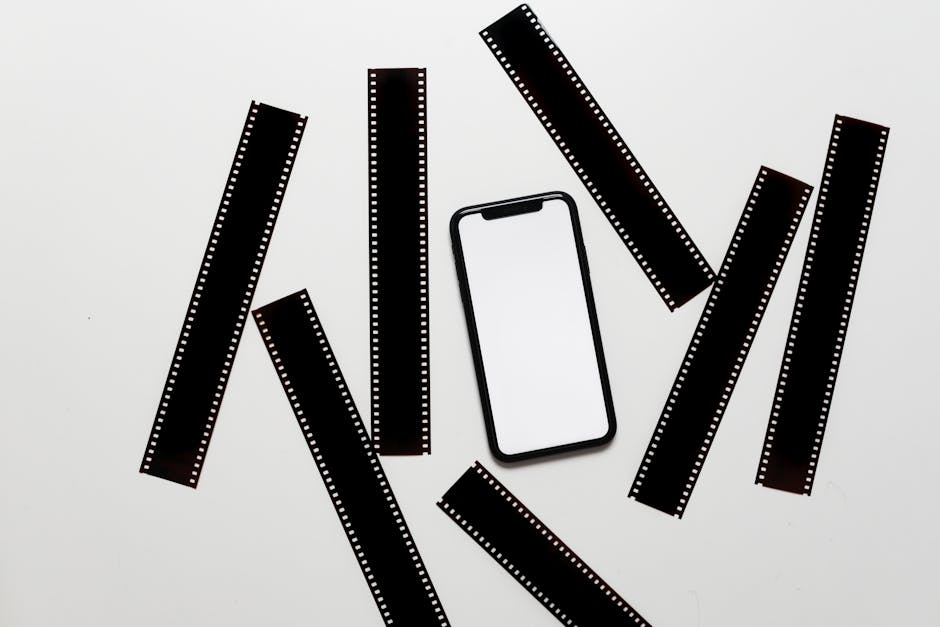 A diverse business team collaborates on projects in a modern office setting, using technology and notes.