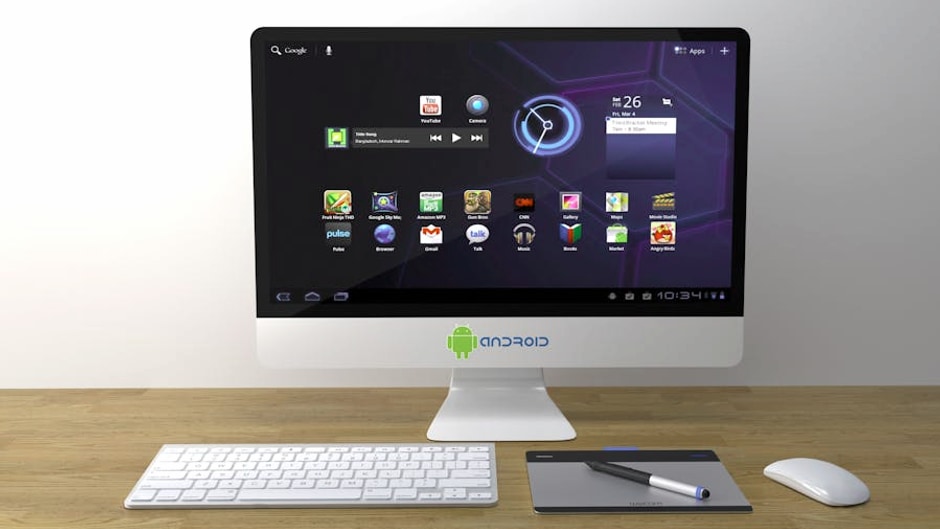 A sleek desktop setup featuring an Android interface on a monitor with keyboard and mouse.